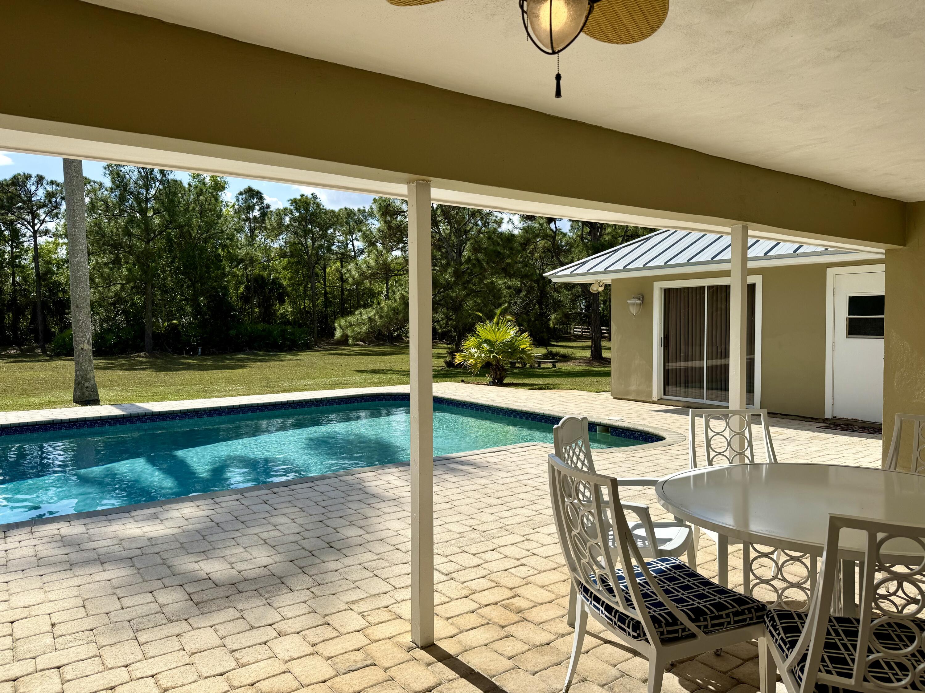 2884 Southeast Ranch Acres Circle Jupiter, FL 33478 - Photo 71 of 93 patio to pool