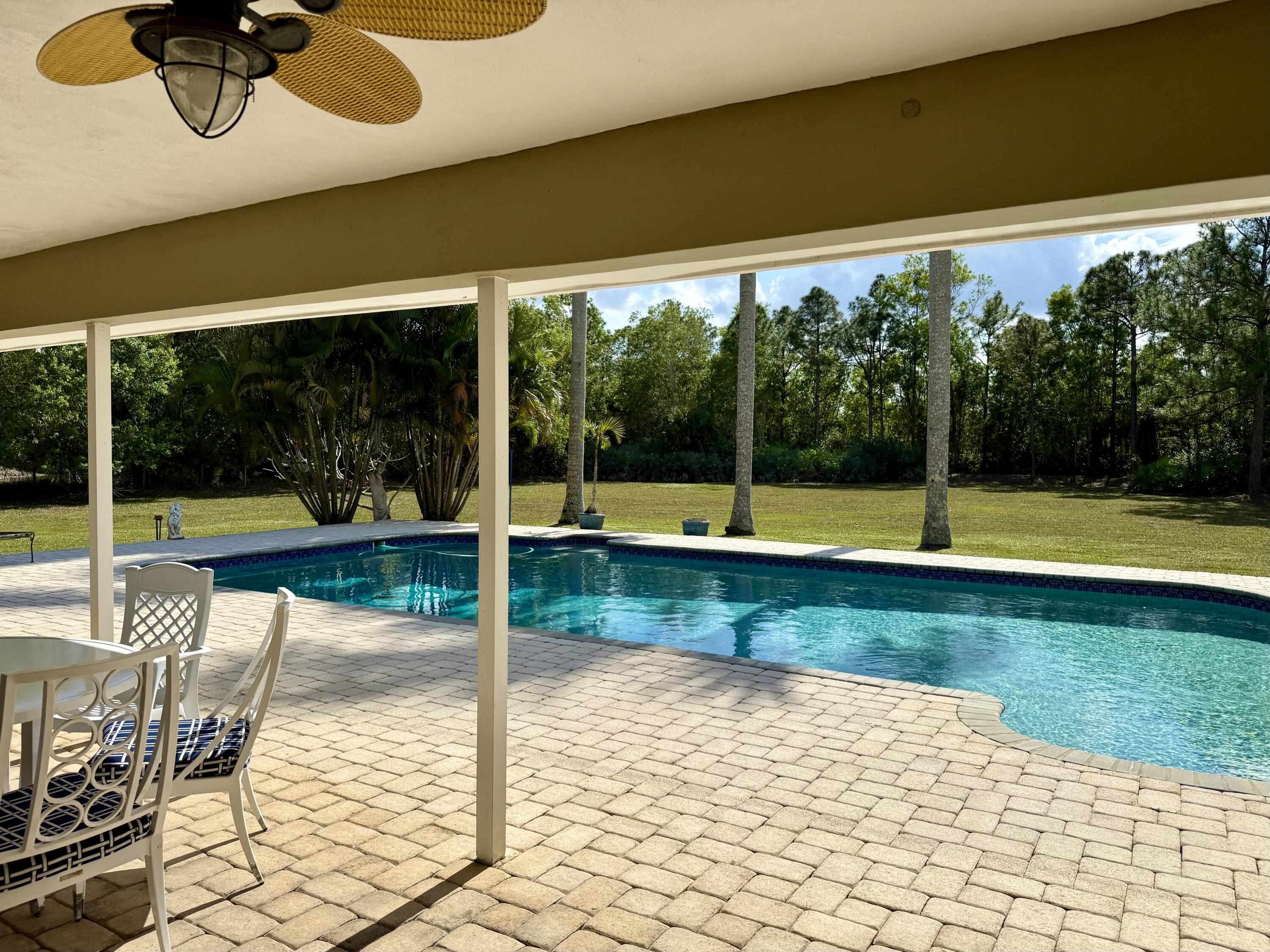 2884 Southeast Ranch Acres Circle Jupiter, FL 33478 - Photo 73 of 93 patio to pool