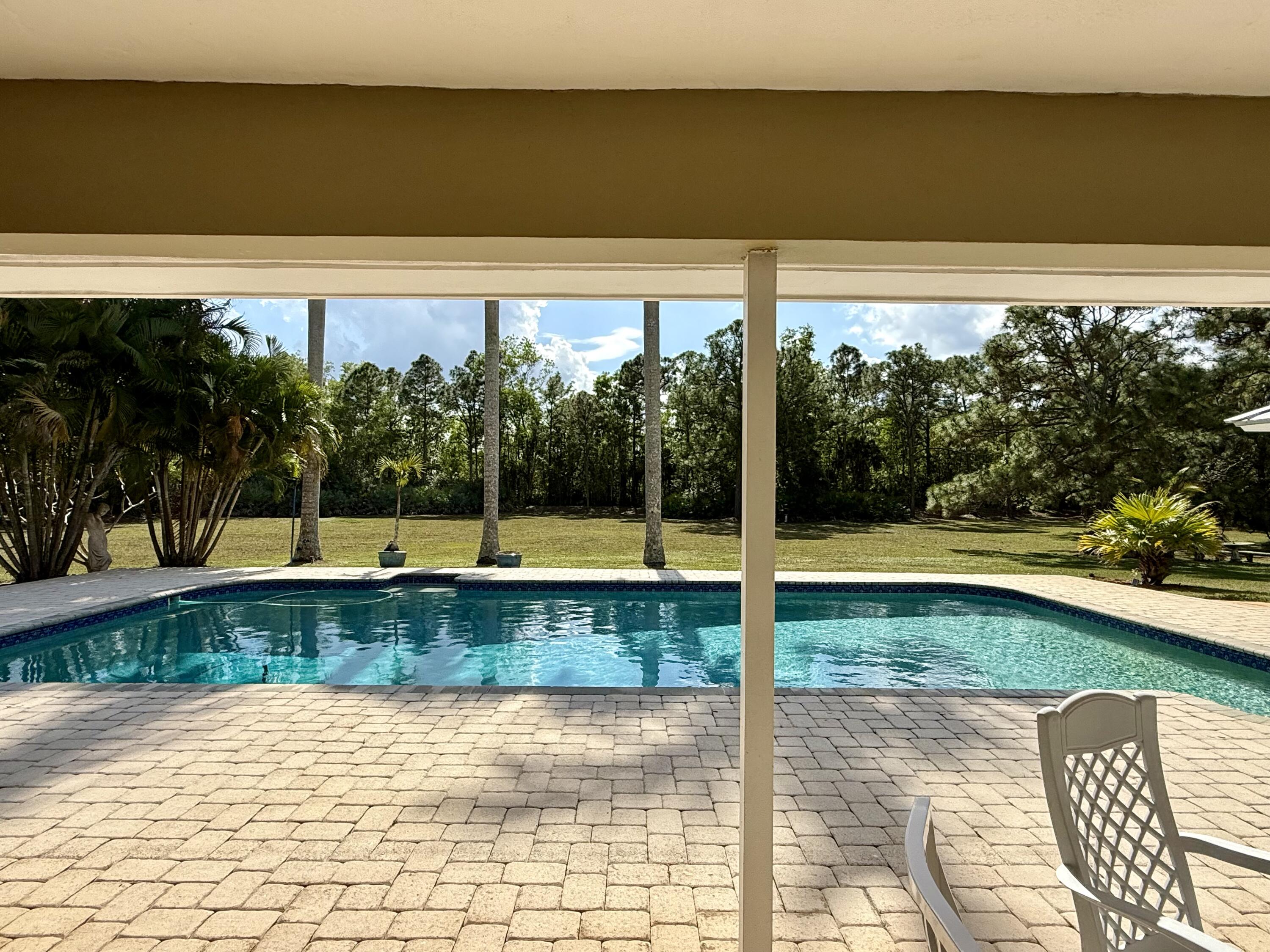 2884 Southeast Ranch Acres Circle Jupiter, FL 33478 - Photo 75 of 93 patio to pool