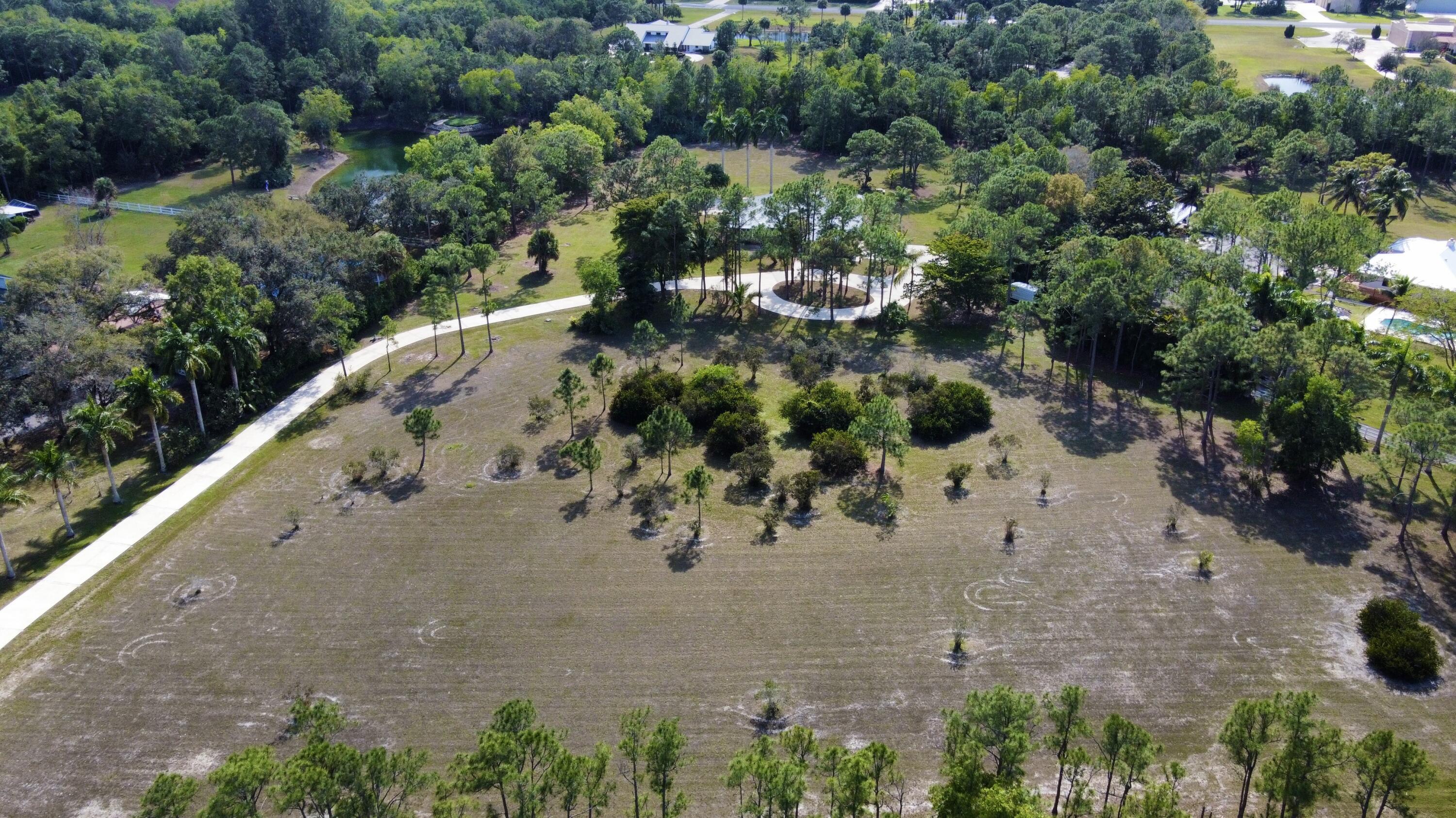 2884 Southeast Ranch Acres Circle Jupiter, FL 33478 - Photo 78 of 93 aerial front