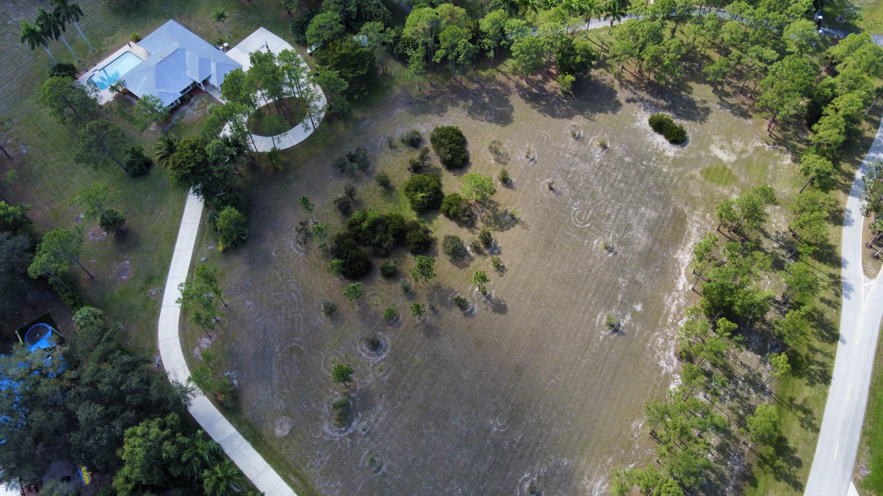 2884 Southeast Ranch Acres Circle Jupiter, FL 33478 - Photo 79 of 93 aerial front
