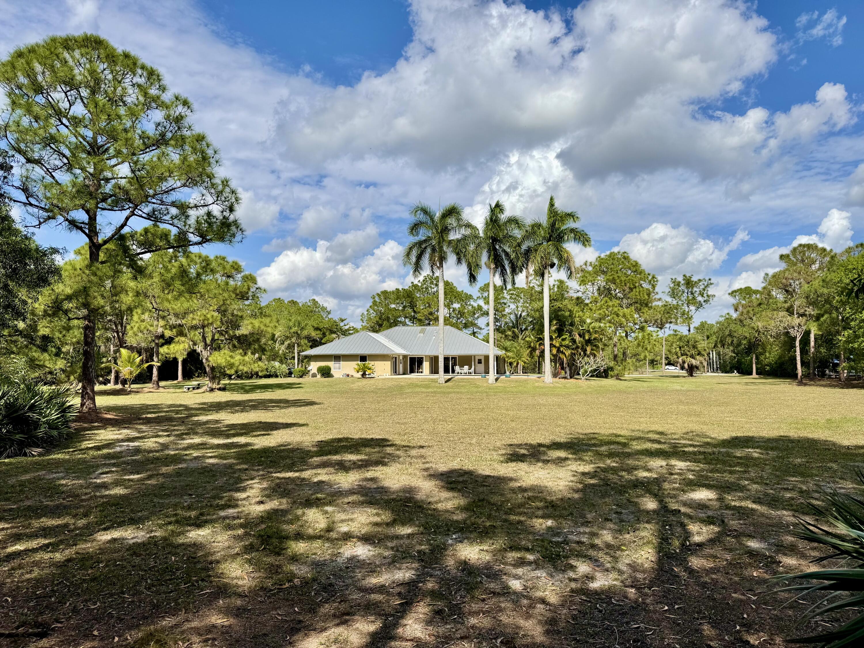 2884 Southeast Ranch Acres Circle Jupiter, FL 33478 - Photo 87 of 93 back of property line to house