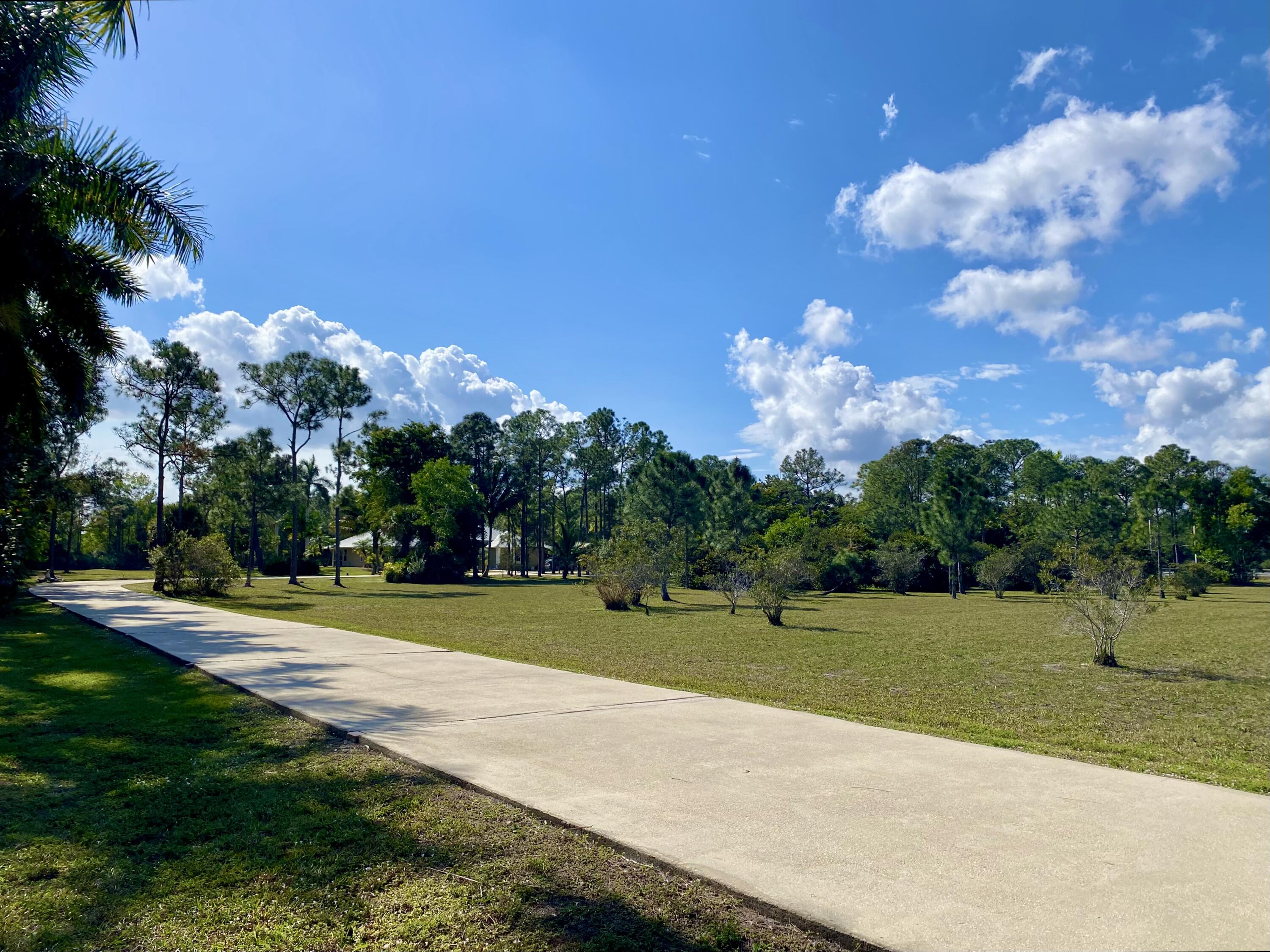 2884 Southeast Ranch Acres Circle Jupiter, FL 33478 - Photo 89 of 93 long driveway