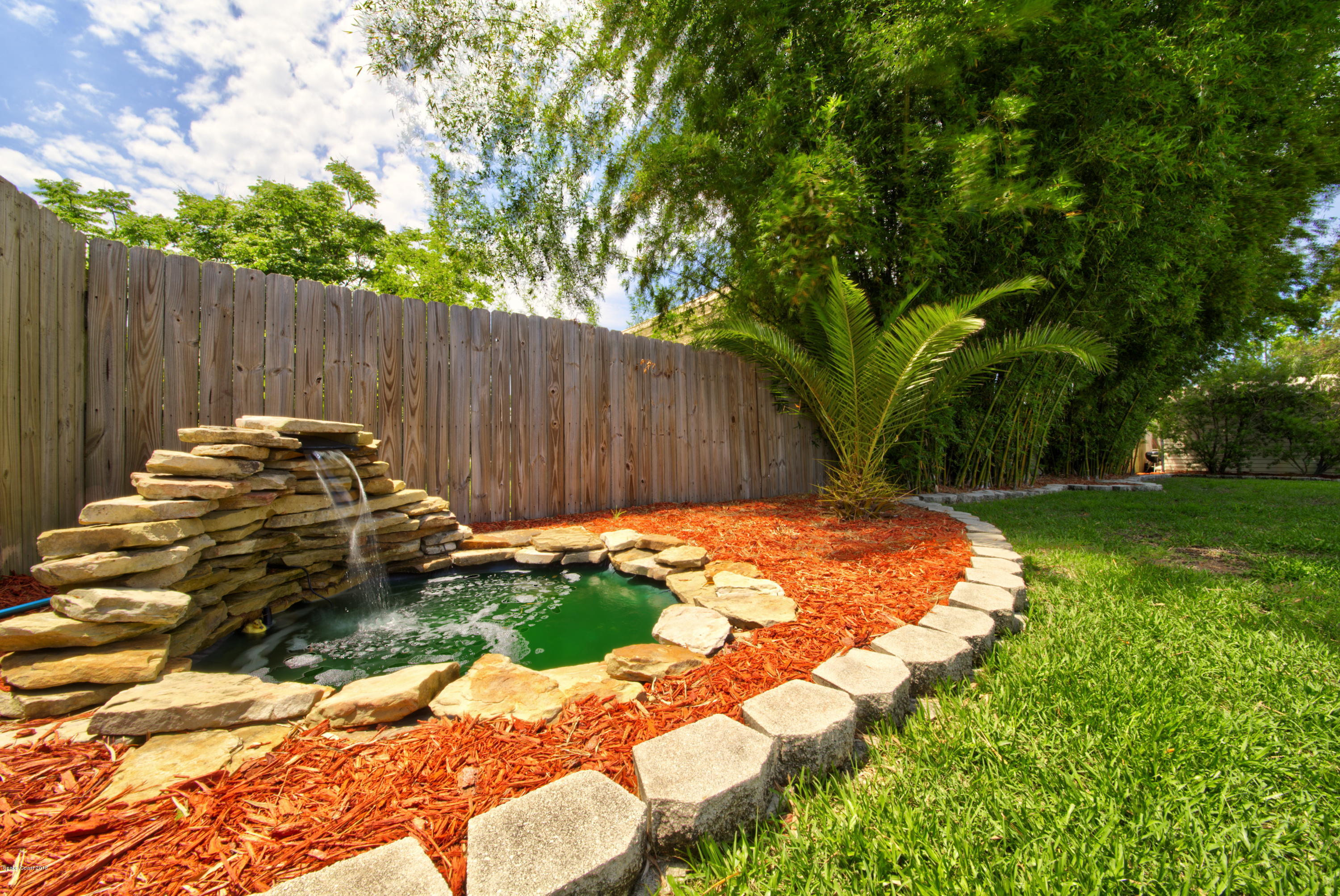 5640 Holden Road Cocoa, FL 32927 - Photo 42 of 42 Backyard Landscaping with Waterfall