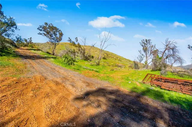a view of a swimming pool with a table and chairs