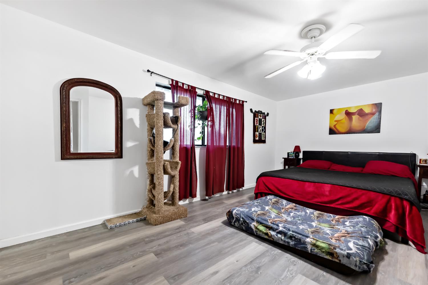 37000 Sand Creek Road Squaw Valley, CA 93675 - Photo 17 of 20 a bedroom with a bed and a chandelier