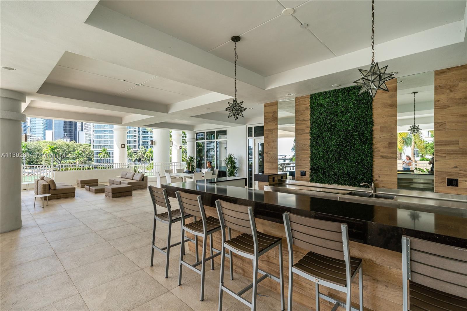 801 Brickell Key Boulevard, Unit 1701 Miami, FL 33131 - Photo 27 of 32 a view of a dining room with furniture window and outside view
