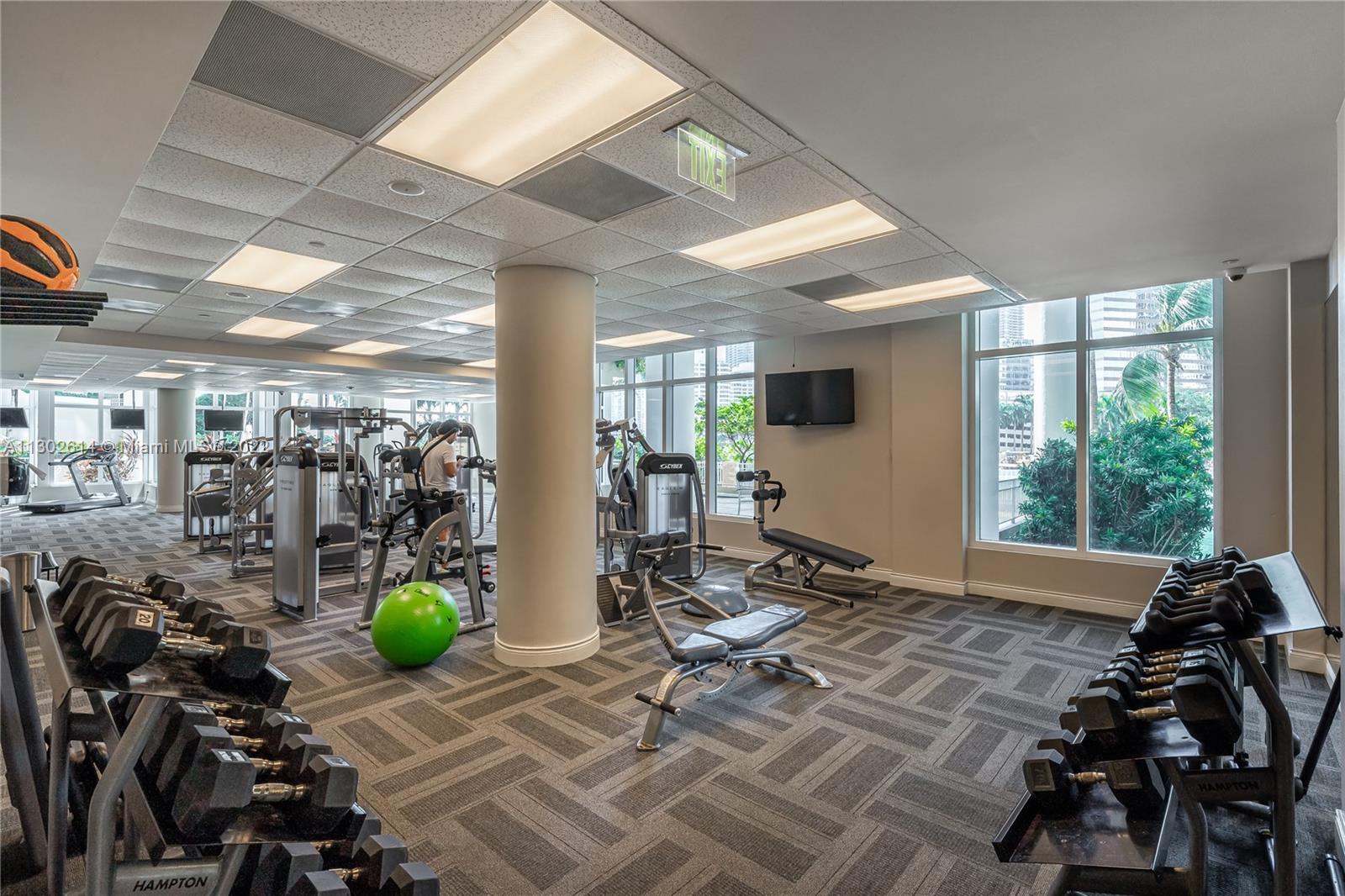 801 Brickell Key Boulevard, Unit 1701 Miami, FL 33131 - Photo 30 of 32 a view of a room with gym equipment