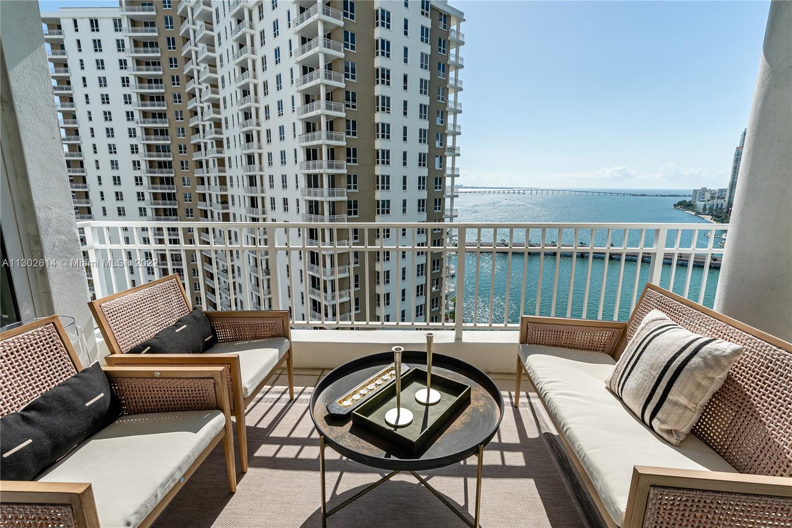 801 Brickell Key Boulevard, Unit 1701 Miami, FL 33131 - Photo 3 of 32 a view of a balcony with furniture