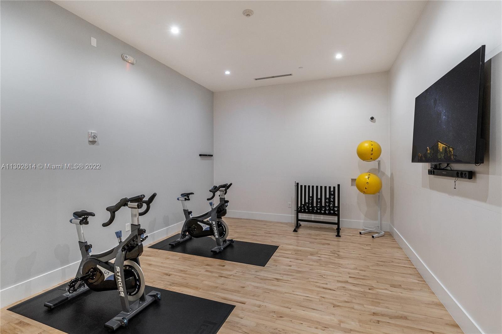 801 Brickell Key Boulevard, Unit 1701 Miami, FL 33131 - Photo 31 of 32 a view of a room with gym equipment