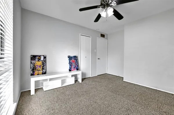 a very nice looking room with a ceiling fan