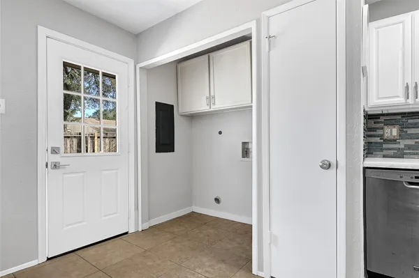 a view of kitchen and utility room