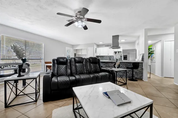 a living room with furniture and a table