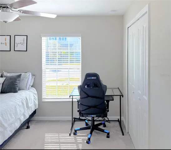 a bedroom with a workspace