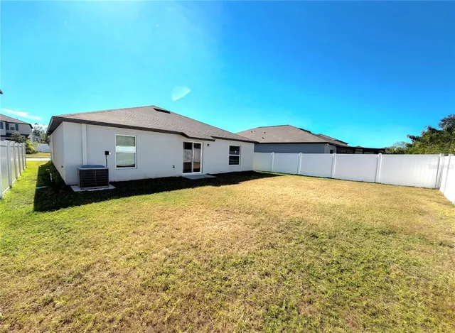 a house with trees in the background