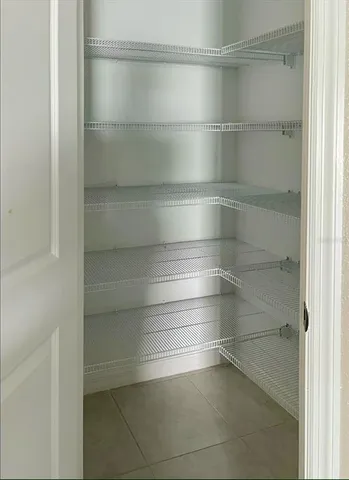 a view of an empty walk in closet