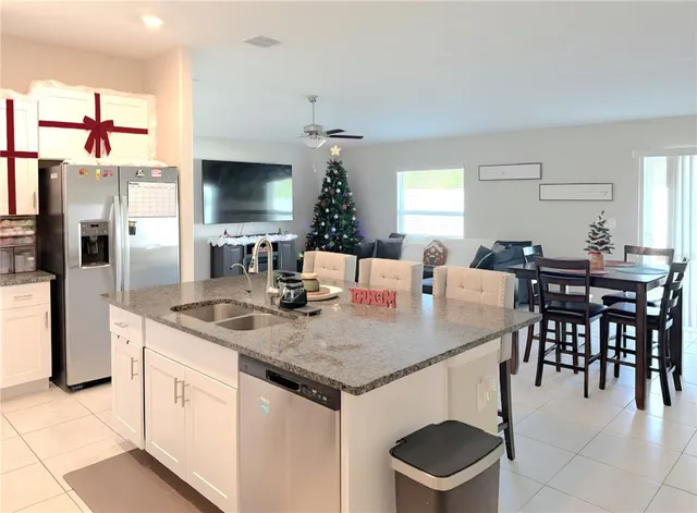 a view of kitchen island with stainless steel appliances