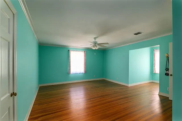 a view of room with window and hardwood