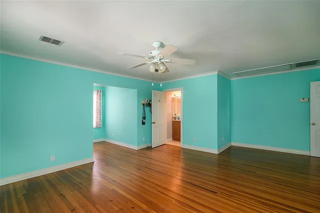 a view of room with window and ceiling fan