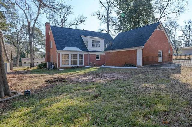 a house with trees in the background