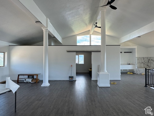 6909 East Spring Drive, Unit 19 Springville, UT 84663 - Photo 22 of 118 Expansive interior space featuring vaulted ceilings, wood-finish flooring, architectural columns, and a built-in wet bar with a stone-look backsplash