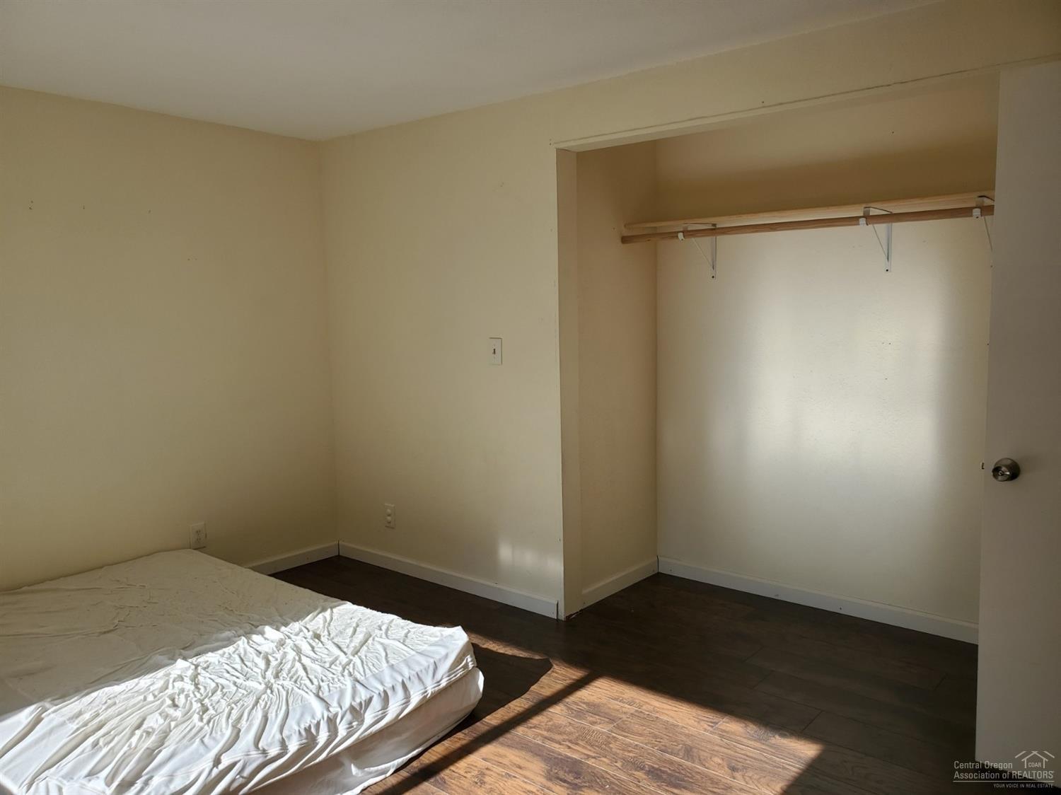 16860 Jacinto Road Bend, OR 97707 - Photo 16 of 24 a bedroom with a bed and a window