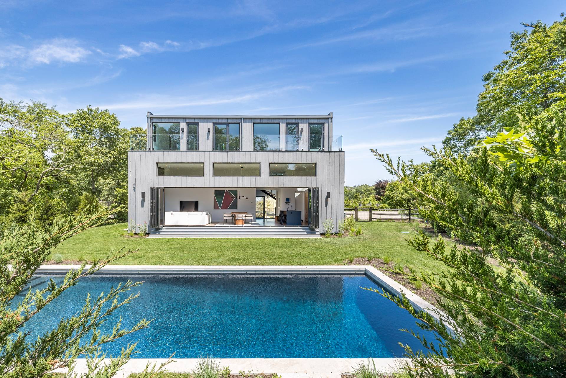 5 Ridge Lane Hampton Bays, NY 11946 - Photo 1 of 38 a front view of a house with a yard