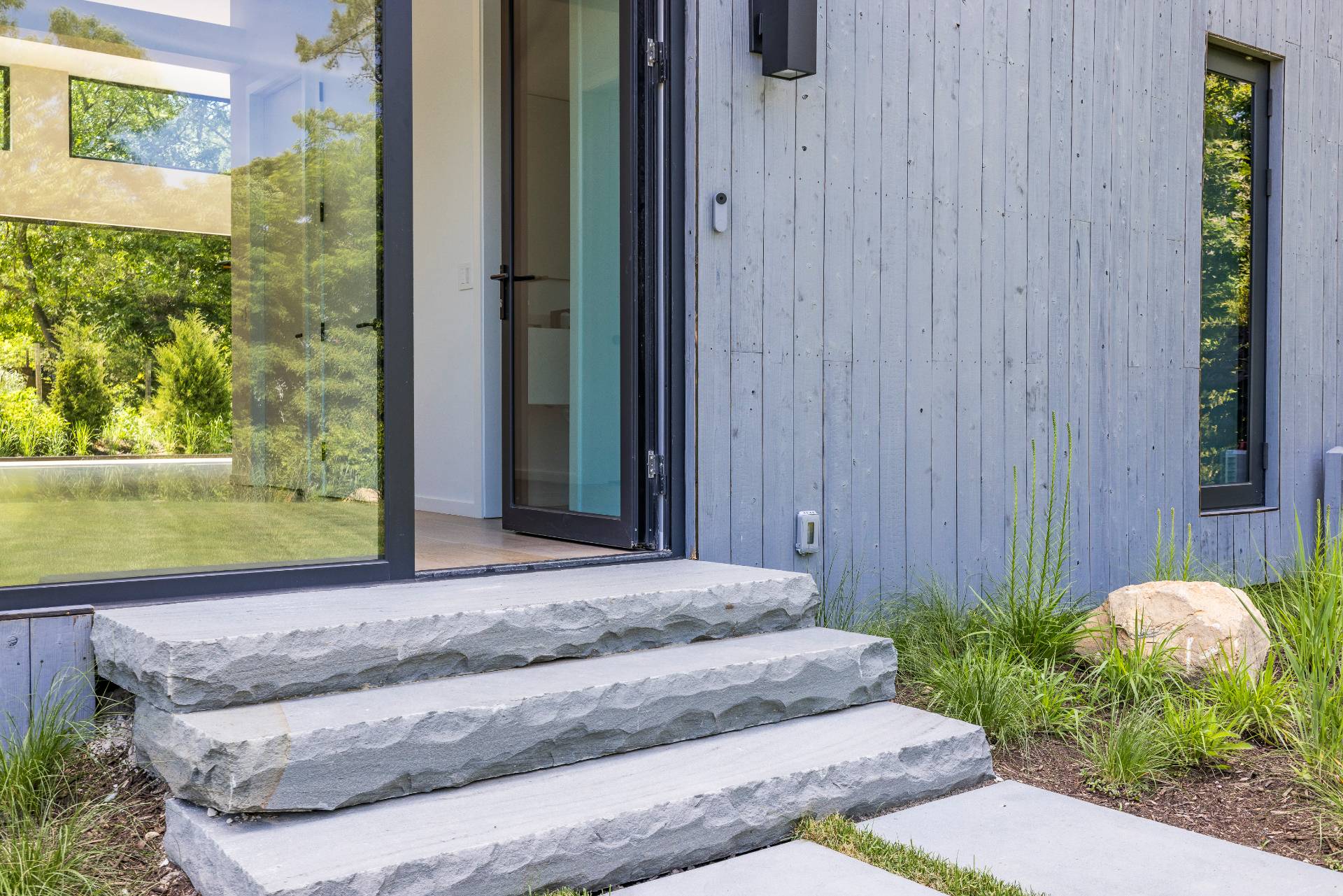 5 Ridge Lane Hampton Bays, NY 11946 - Photo 11 of 38 a front view of a house with garden