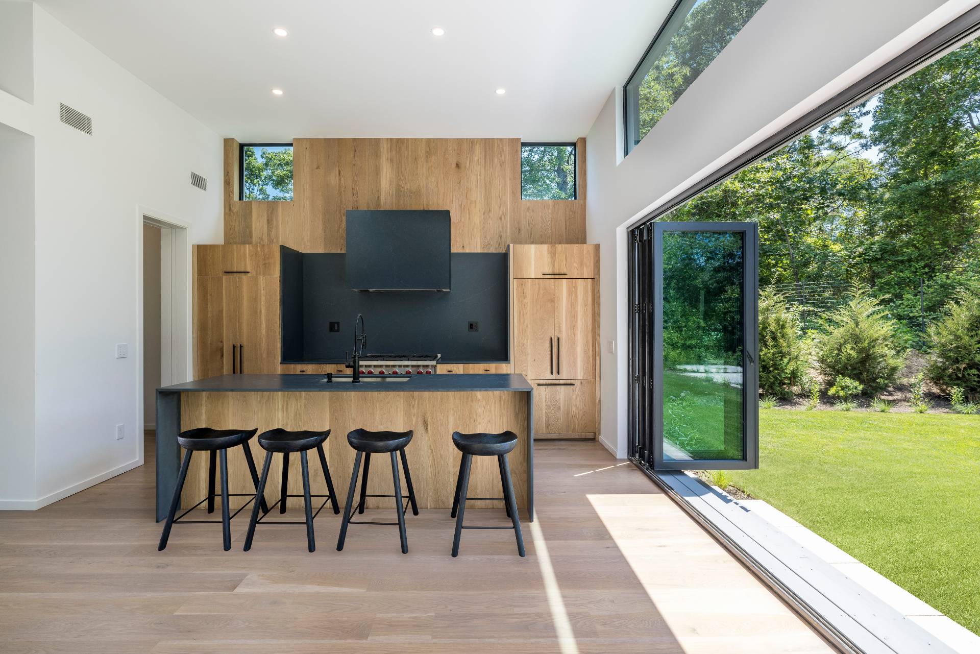 5 Ridge Lane Hampton Bays, NY 11946 - Photo 15 of 38 a living room with stainless steel appliances granite countertop furniture and a garden