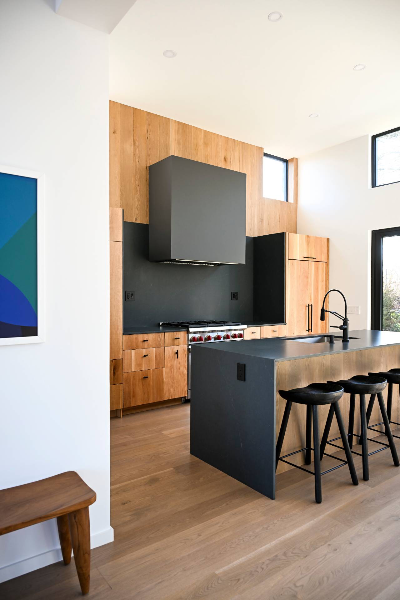 5 Ridge Lane Hampton Bays, NY 11946 - Photo 27 of 38 a living room with stainless steel appliances kitchen island granite countertop a sink and a wooden floor