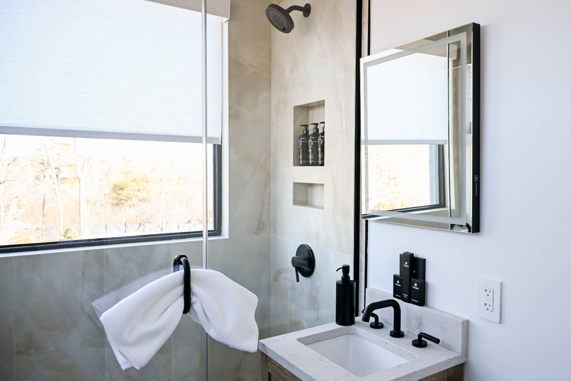5 Ridge Lane Hampton Bays, NY 11946 - Photo 33 of 38 a bathroom with a sink and mirror with bathtub