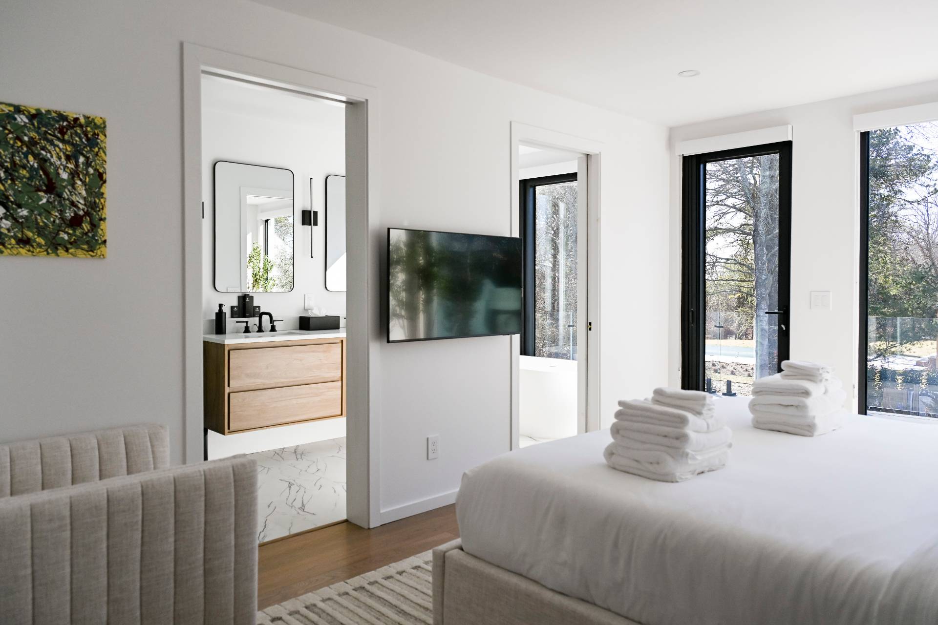 5 Ridge Lane Hampton Bays, NY 11946 - Photo 37 of 38 a bedroom with a bed and glass door