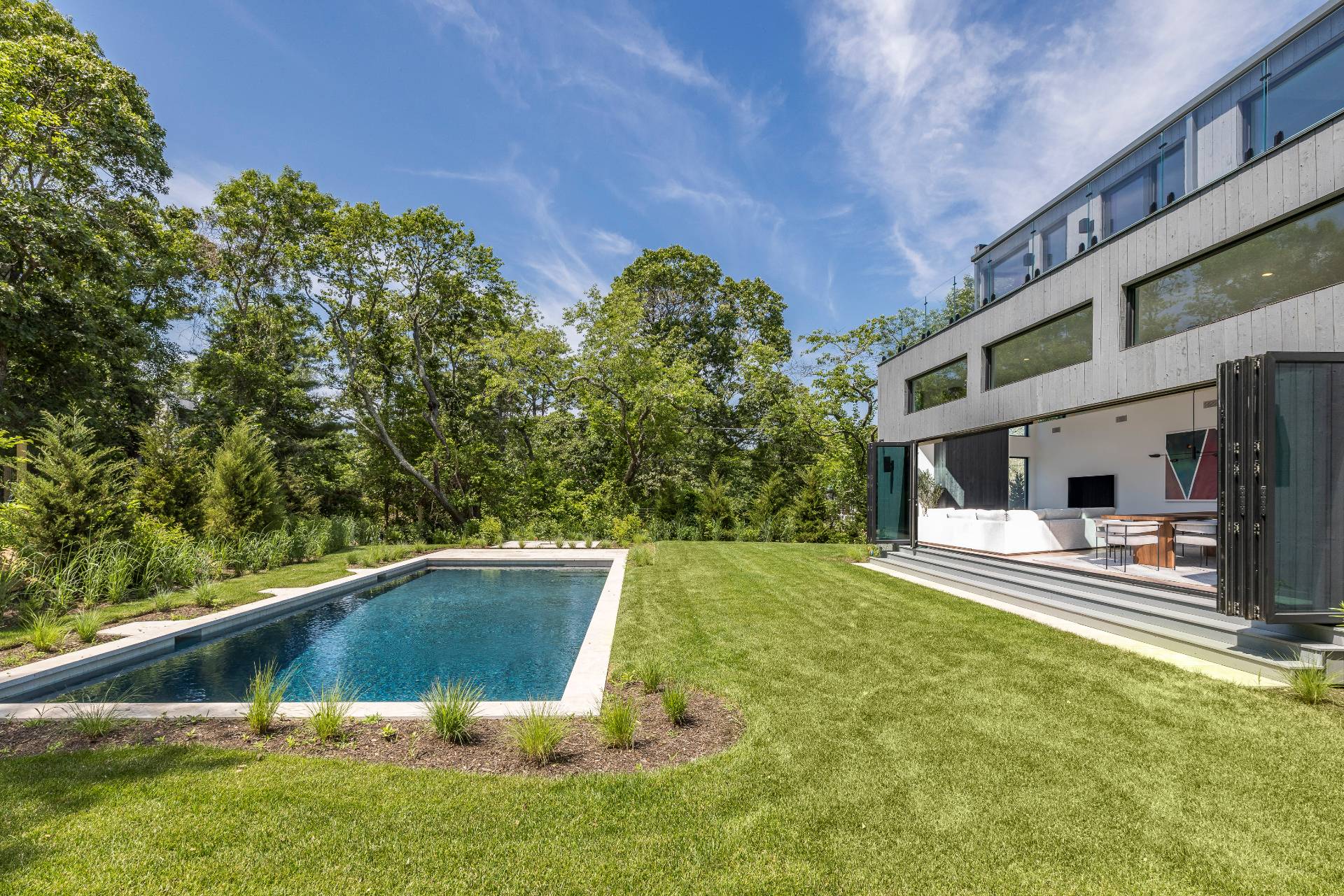 5 Ridge Lane Hampton Bays, NY 11946 - Photo 5 of 38 a view of a swimming pool with a patio