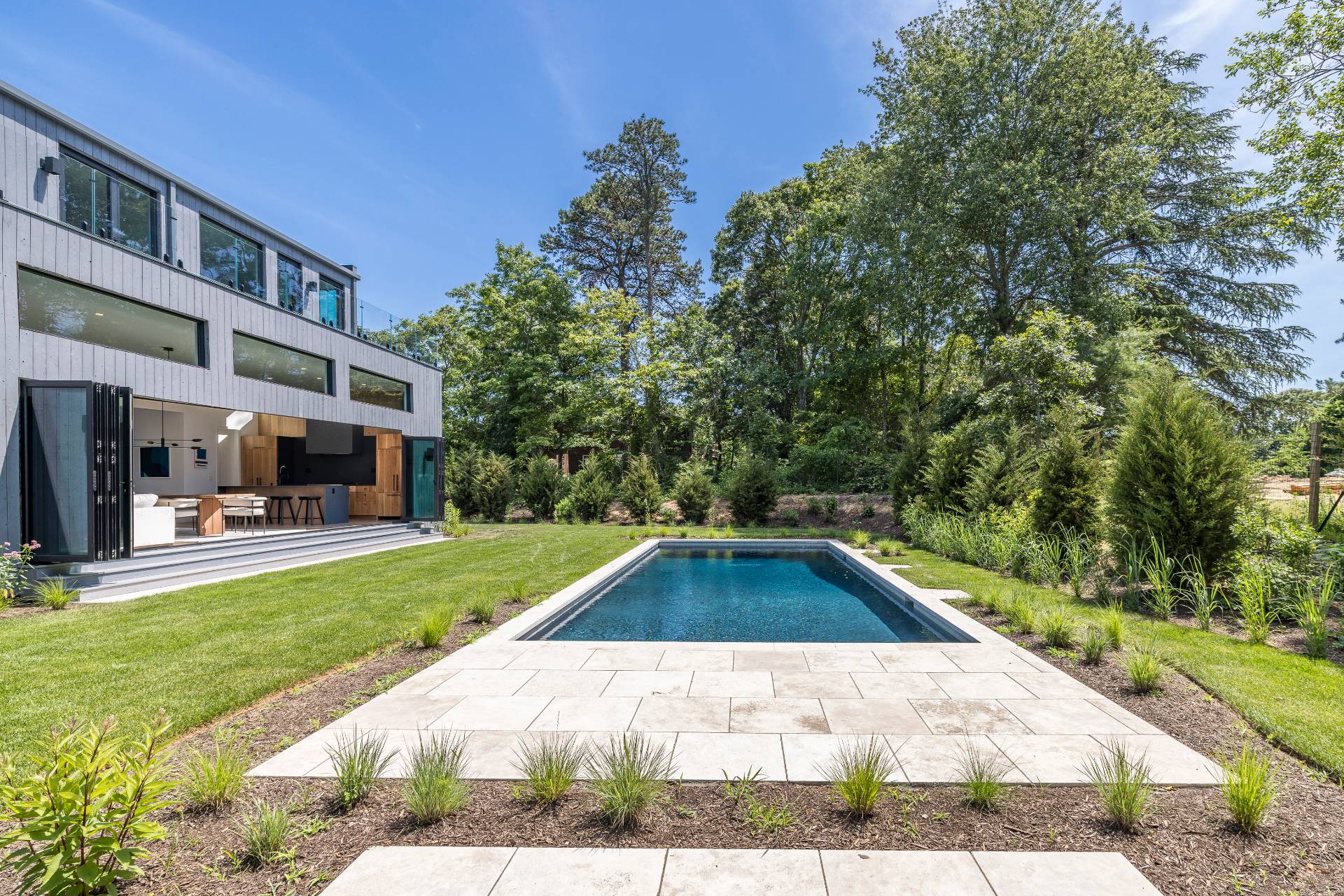 5 Ridge Lane Hampton Bays, NY 11946 - Photo 6 of 38 a view of a swimming pool with a patio and a yard