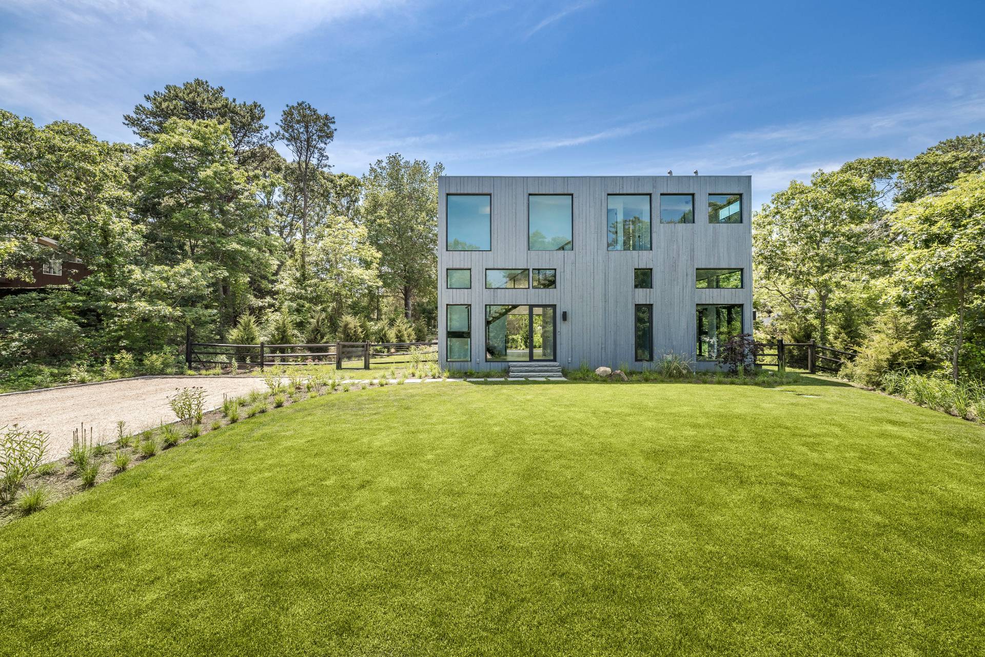 5 Ridge Lane Hampton Bays, NY 11946 - Photo 9 of 38 a view of an house with backyard and garden