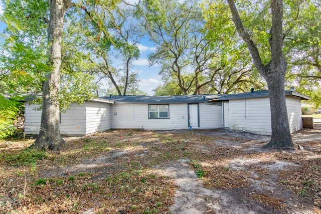 a view of a house with a tree