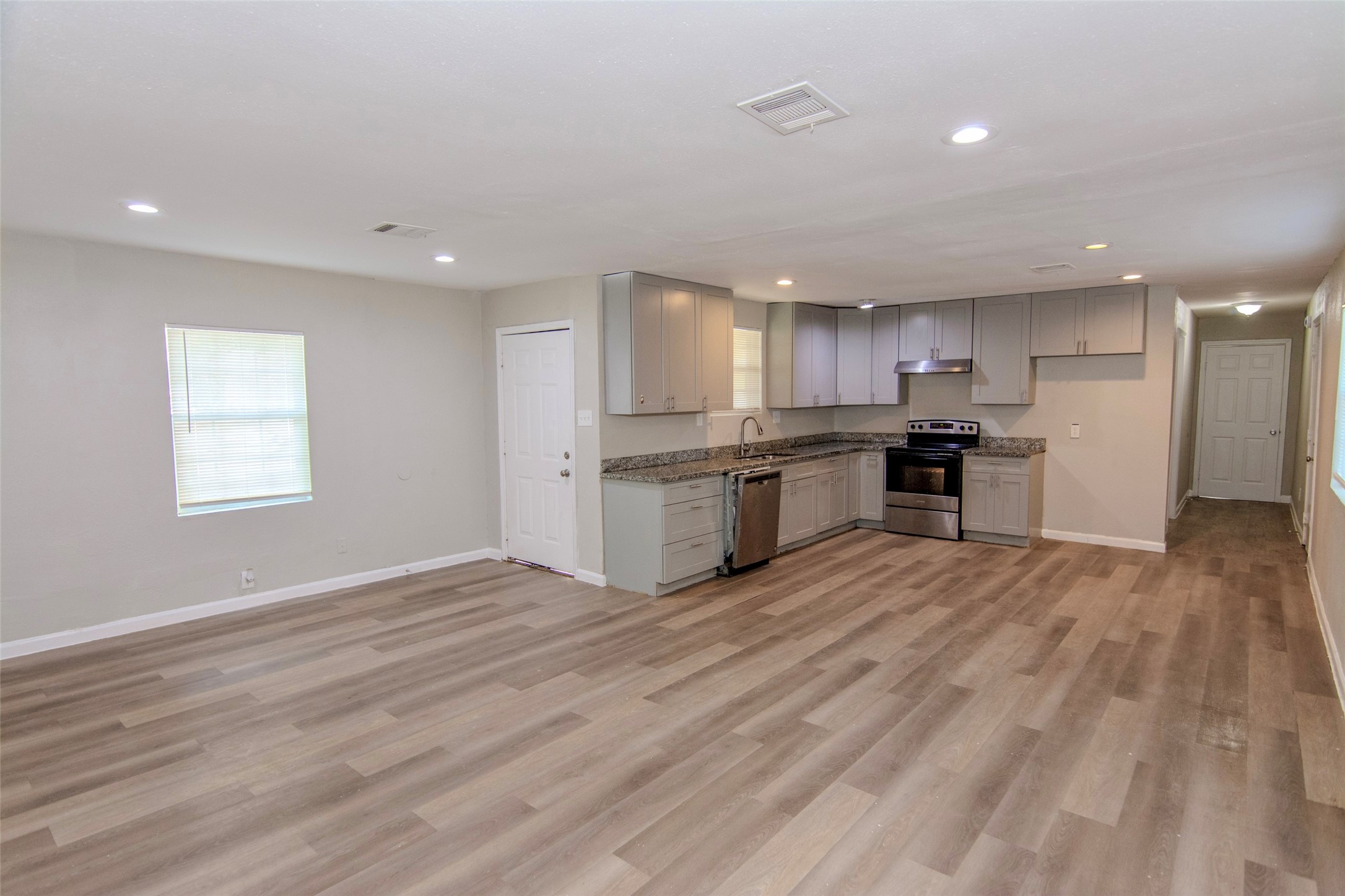 904 Mobile Drive Pasadena, TX 77506 - Photo 4 of 13 a view of kitchen with wooden floor and window