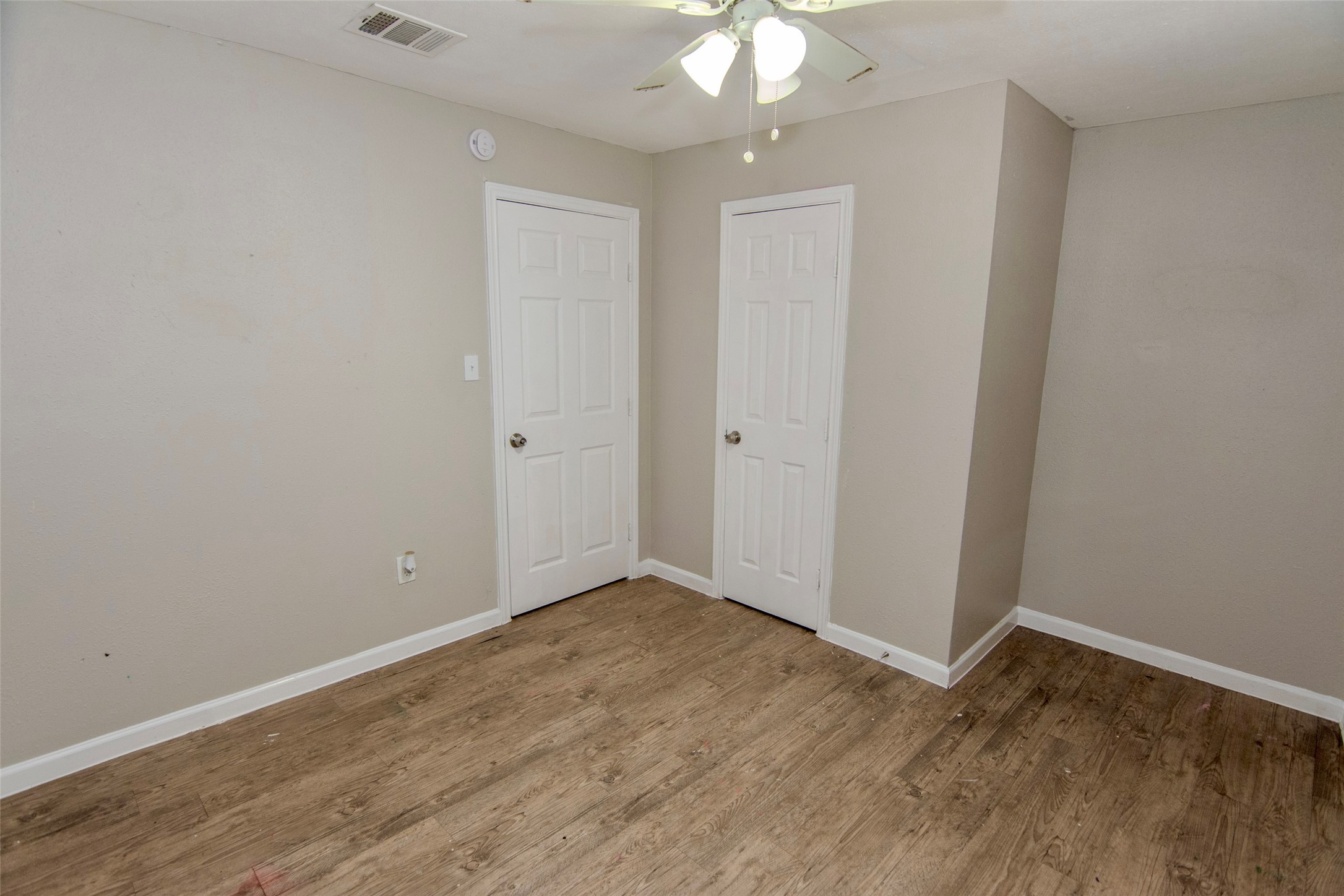 904 Mobile Drive Pasadena, TX 77506 - Photo 9 of 13 wooden floor in an empty room