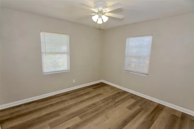 a view of room with window and ceiling fan