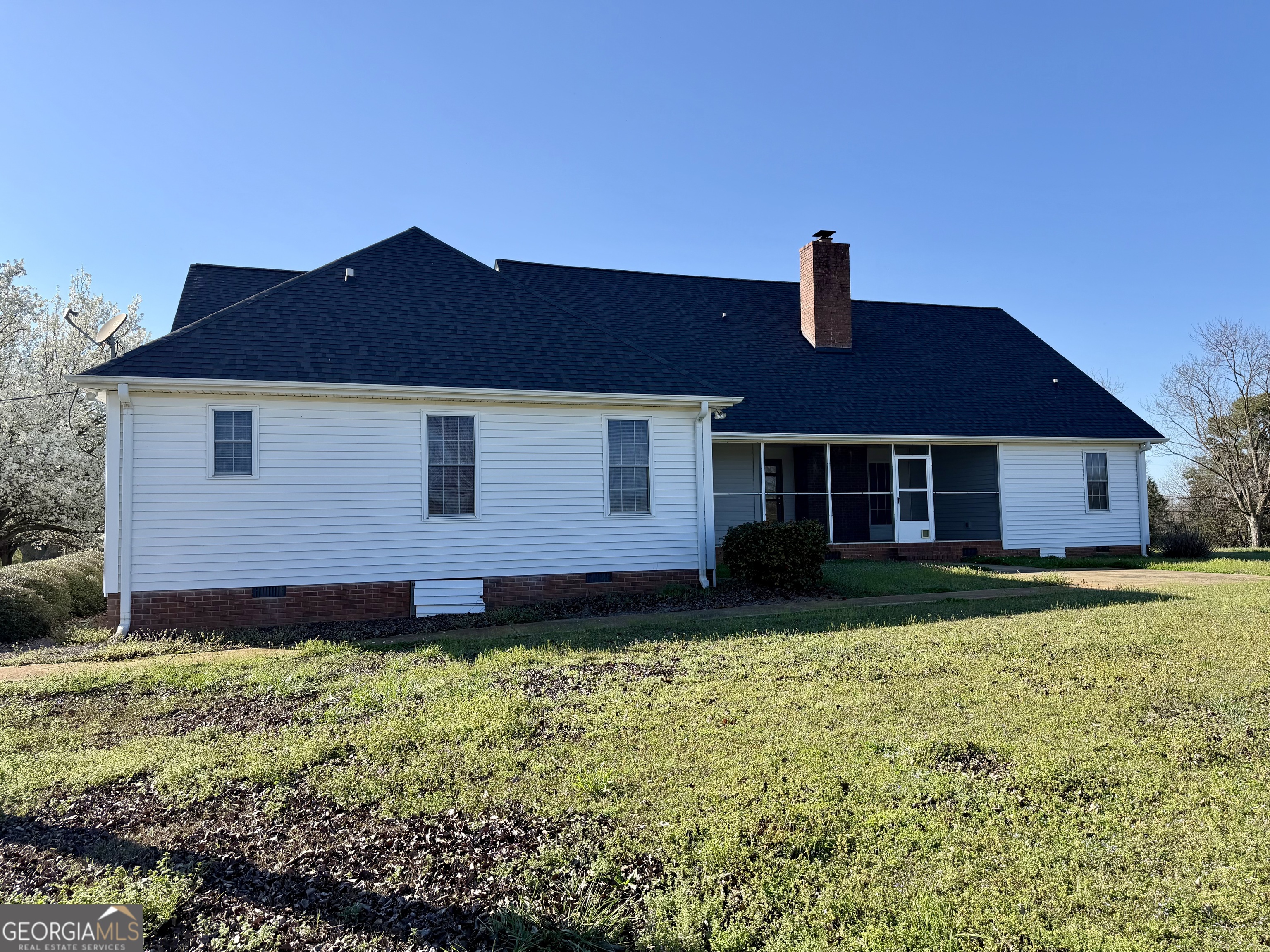 494 Broad Street Bowman, GA 30624 - Photo 8 of 65 a front view of a house with a yard