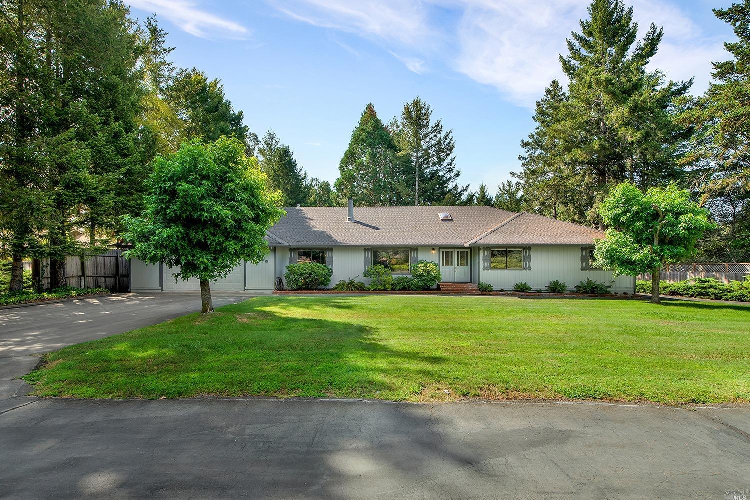 1633 Schaeffer Road Sebastopol, CA 95472 - Photo 1 of 1 a view of a big house in a big yard with large trees