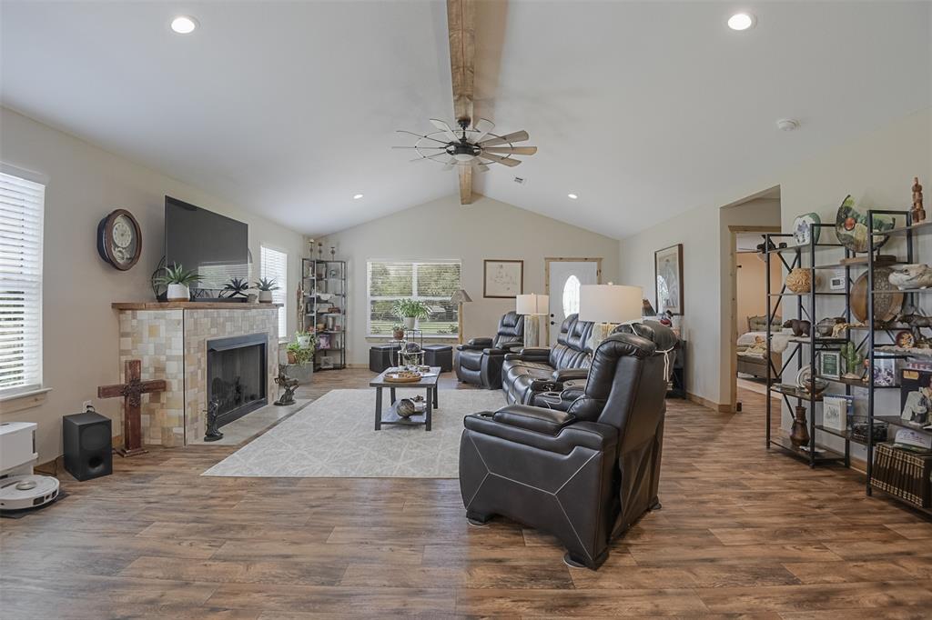 2683 Bells Chapel Road Palmer, TX 75152 - Photo 3 of 30 a living room with furniture a fireplace and a large window