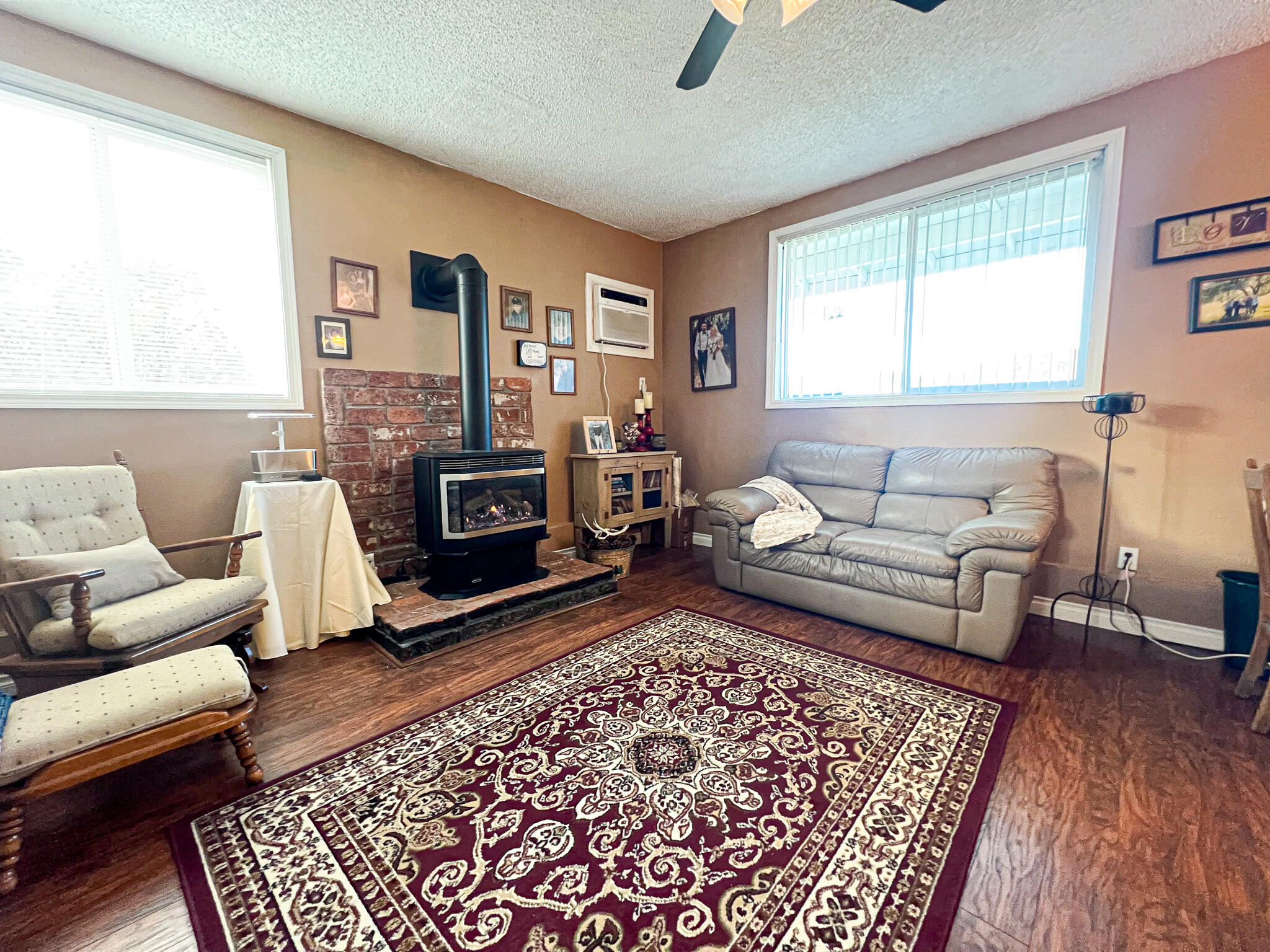 1225 East B Street Fossil, OR 97830 - Photo 12 of 33 a living room with furniture and a fireplace