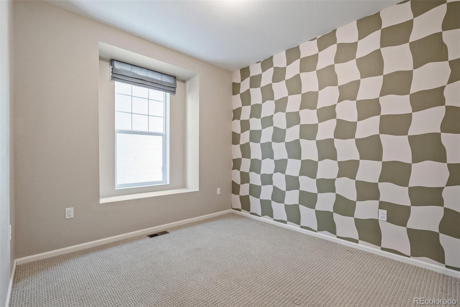 2155 Farmlore Drive Brighton, CO 80601 - Photo 30 of 41 a view of a bedroom with a window
