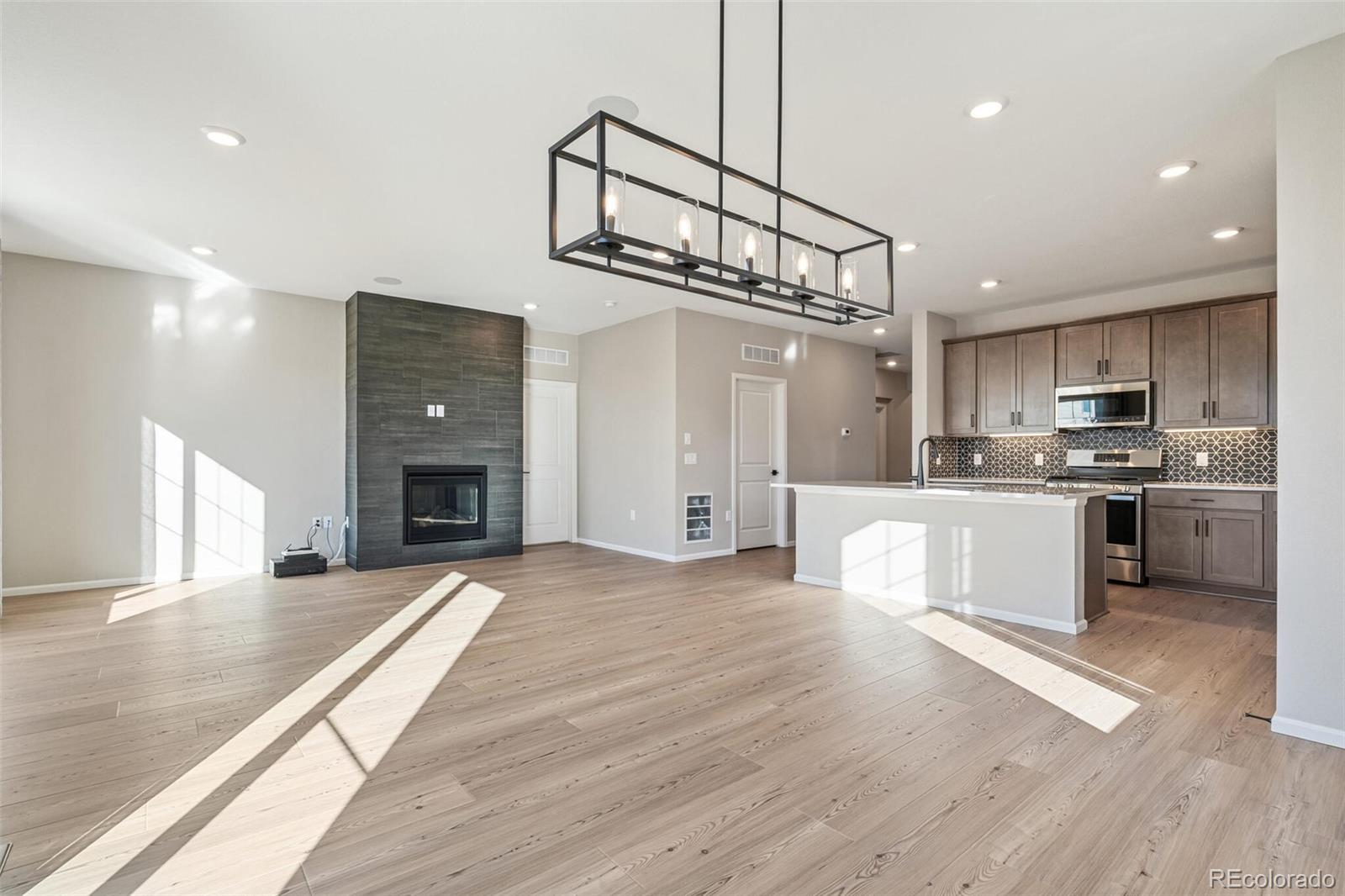 2155 Farmlore Drive Brighton, CO 80601 - Photo 9 of 41 a view of kitchen with sink microwave and stove