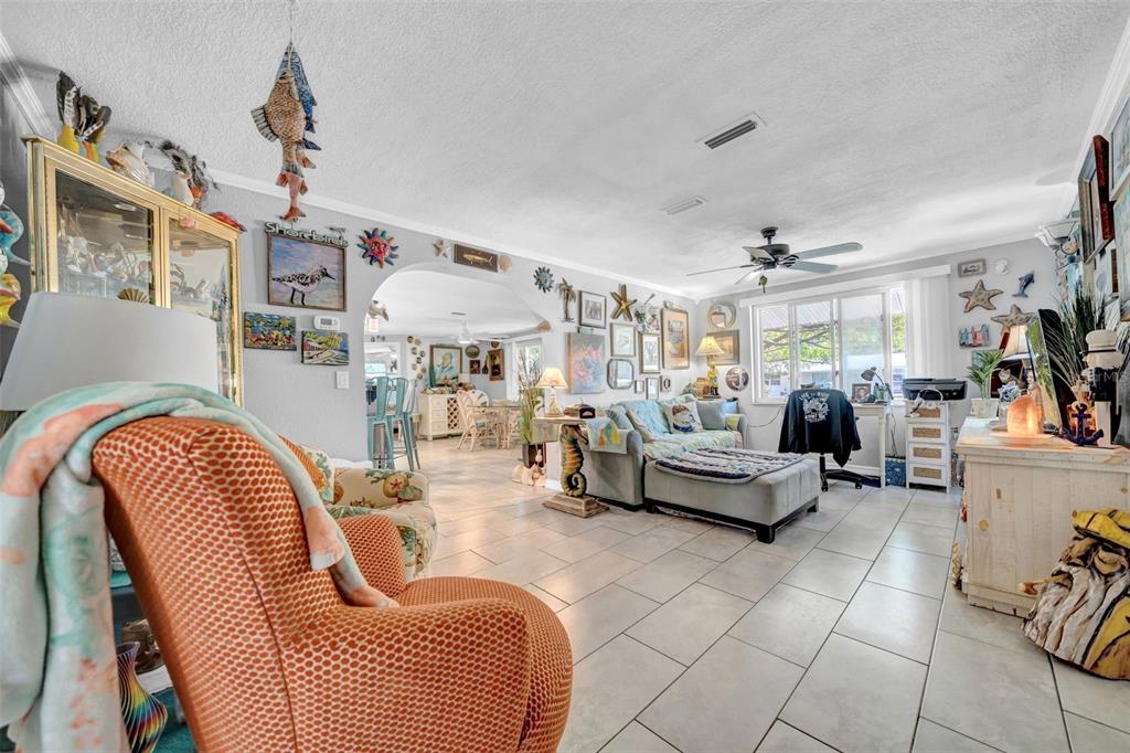 7353 Banner Street New Port Richey, FL 34653 - Photo 16 of 49 a living room with furniture and a chandelier