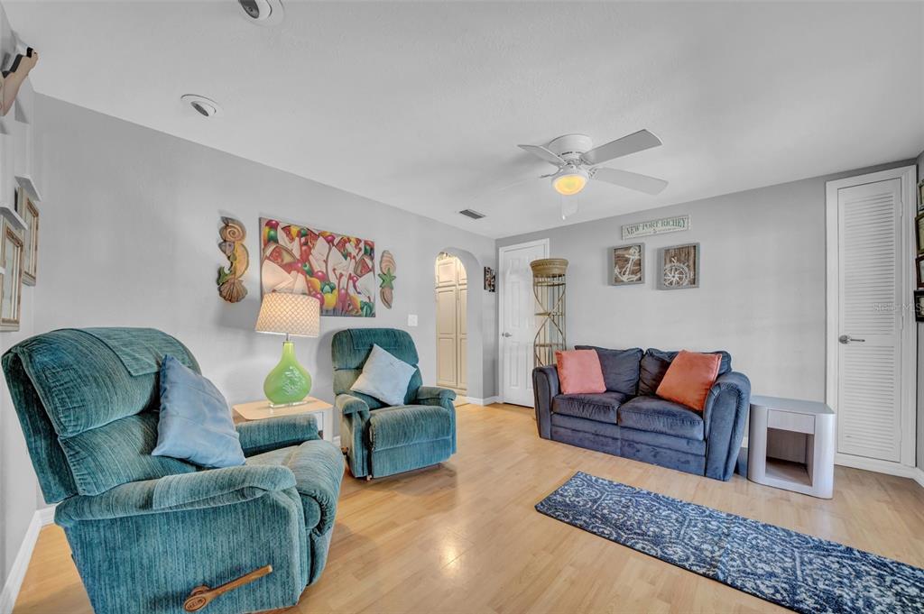 7353 Banner Street New Port Richey, FL 34653 - Photo 25 of 49 a living room with furniture and a rug