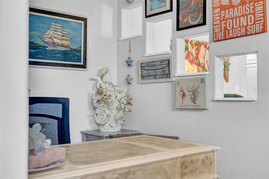 7353 Banner Street New Port Richey, FL 34653 - Photo 27 of 49 a bedroom with a bed and a painting on the wall