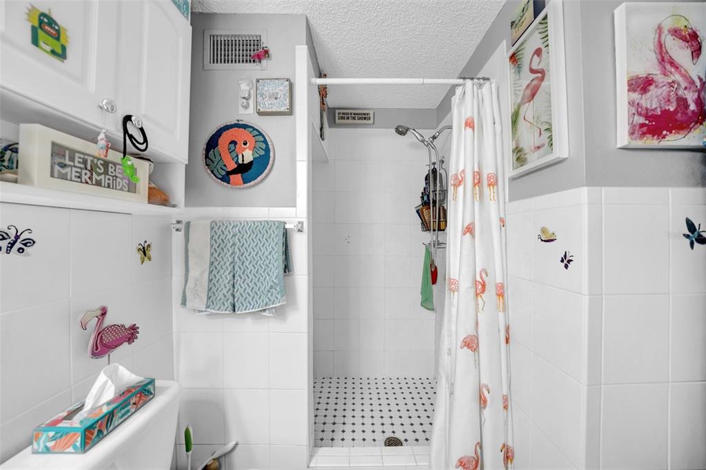 7353 Banner Street New Port Richey, FL 34653 - Photo 34 of 49 a cabinet with a painting on the wall and a picture on the wall