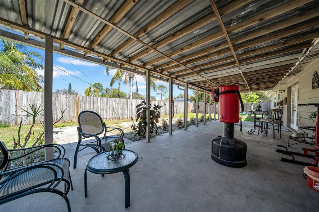 7353 Banner Street New Port Richey, FL 34653 - Photo 36 of 49 a view of a chairs and tables in patio